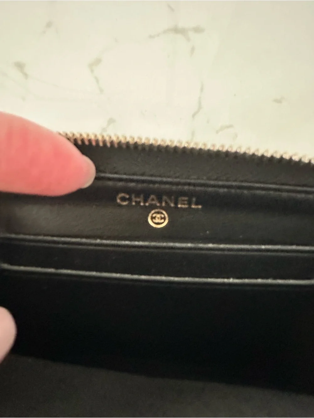 CHANEL Black Quilted Caviar Leather Zip Wallet with Gold Accents